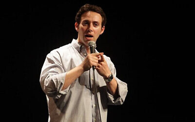Avi Liberman performs at Comedy for Koby. (Photo by Yissachar Ruas via The Times of Israel)
