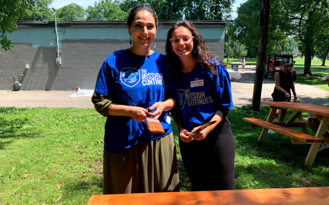 Hadassah Cowen and Sarah Hertzberg staining a table at the Juneteenth event (Photo by James Musial) Hadassah Cowen and Sarah Hertzberg staining a table at the Juneteenth event (Photo by James Musial)