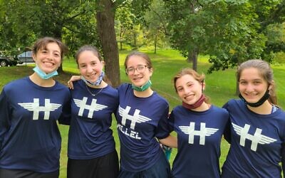 Miriam Levari, center, and Hillel Academy cross country teammates. Photo by Rabbi Sam Weinberg
