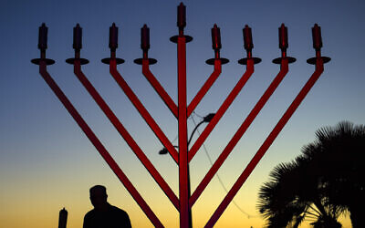 A Chabad menorah, distinguished by the diagonal—rather than curved—arms. (Photo by Mindy Schauer/Digital First Media/Orange County Register via Getty Images via JTA)