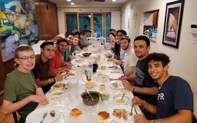 Carnegie Mellon University students enjoy a meal at Chabad of CMU (Photo courtesy of Rabbi Shlomo Silverman)
