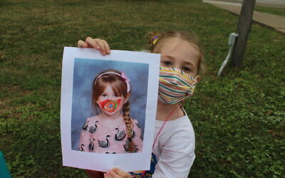 Community Day School Early Childhood Center student Alana Binning has incorporated masks into her artwork. Photo provided by Community Day School.