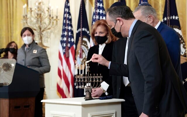Second Gentleman Doug Emhoff lights a menorah at a Hanukkah ceremony in the East Room of the White House, Dec. 1, 2021. (Anna Moneymaker/Getty Images)