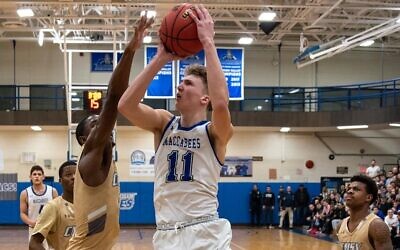 Ryan Turell plays in a game for the Yeshiva University Maccabees. (Courtesy of Yeshiva University)
