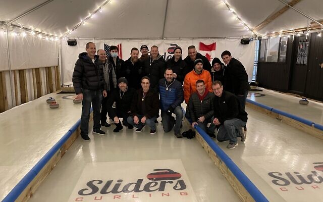 Men spanning the Pittsburgh region took to the ice for curling and friendship. Photo by Evan Stein.