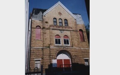 The former Shaaray Tefillah synagogue — seen here in an archival photograph by Gerald Sapir from the 1990s — still stands on Miller Street in the Hill District today. (Image courtesy of Rauh Jewish Archives)