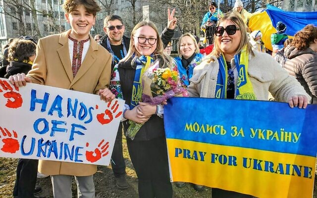 Teenagers Andrew Romanchik, Kateryna Petrylo and Hrystyna Petrylo organized Sunday's rally to support Ukraine. Photo by Adam Reinherz