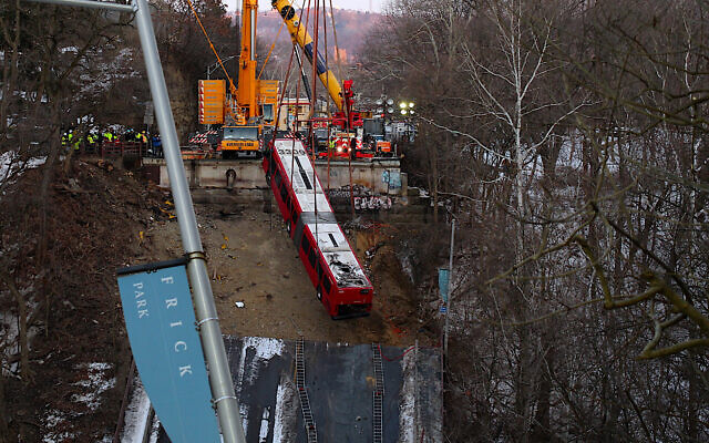 The bus is lifted off the collapsed bridge. Photo by Eli Kurs-Lasky @stillcityphotography