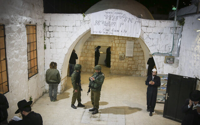Under heavy Israeli army security, Orthodox Jews pray at Joseph's Tomb in the West Bank city of Nablus, Apr. 3, 2017. (Gershon Elinson/FLASH90)