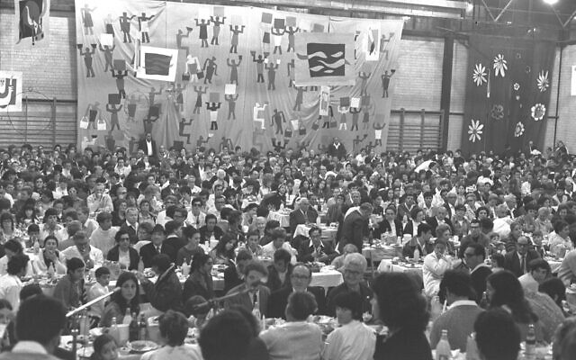 A Passover Seder for 1,500 people is held in the decorated sports hall at Kibbutz Na'an in 1971. Photo by Fritz Cohen courtesy of Government Press Office via Flickr