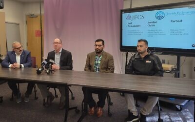 Afghan refugee Farhad Ariai (right) was joined by interpreter Ahmad Yousofzay, JFCS President and CEO Jordan Golin and Jewish Federation of Greater Pittsburgh President and CEO Jeff Finkelstein (left) during an April 14 press conference. Photo by David Rullo.