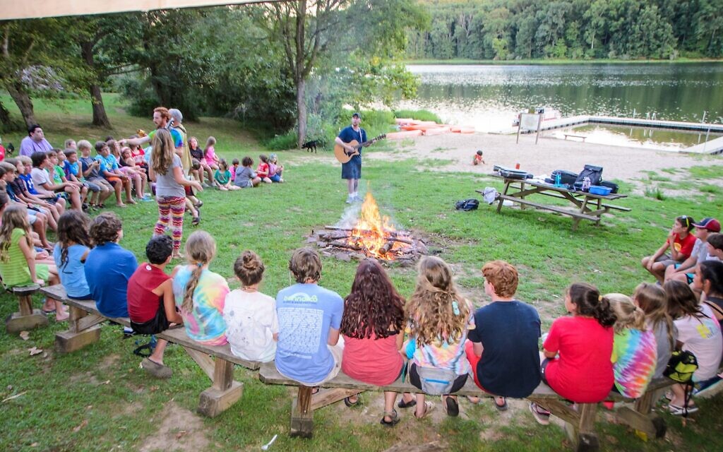 Campers and staff gather around the bonfire at Camp Manitowa, the host site of Camp Indigo Point. (Courtesy Dan Grabel)
