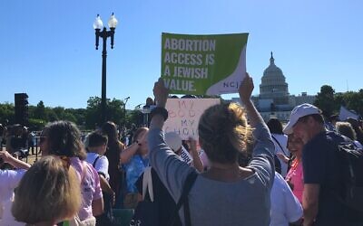 A protester holds up a sign reading "Abortion Access is a Jewish Value" at a rally in front of the US Capitol Building organized by the National Council of Jewish Women, May 17, 2022. (Julia Gergely)
