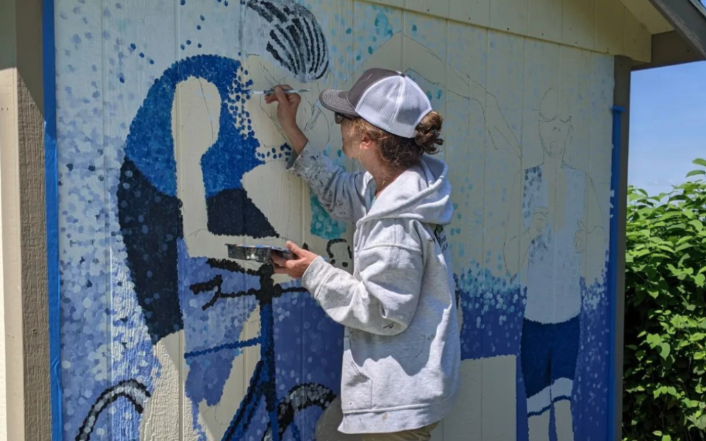 Anita Radin and her Ironman Triathlon mural (Photo courtesy of Anita Radin)