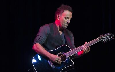 Bruce Springsteen performs onstage during the “Stand Up for Heroes” special at Madison Square Garden in New York City, Nov. 5, 2014. (Photo by Mass Communication Specialist 1st Class Daniel Hinton/Released via Wikimedia)