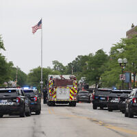 First responders and police force are seen at the scene of the shooting at a July 4 parade in Highland Park, Ill., July 4, 2022. (Youngrae Kim/AFP via Getty Images)