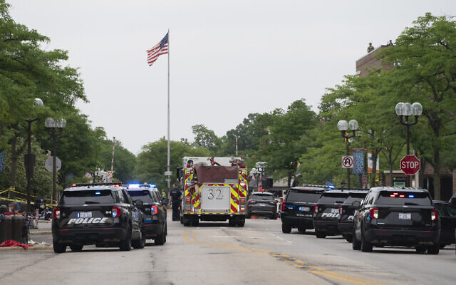 First responders and police force are seen at the scene of the shooting at a July 4 parade in Highland Park, Ill., July 4, 2022. (Youngrae Kim/AFP via Getty Images)