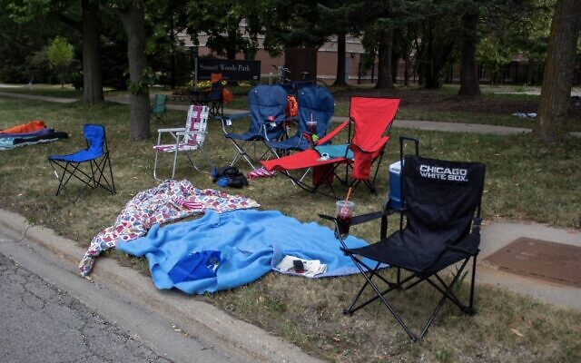 Chairs and blankets are left abandoned after a shooting at a Fourth of July parade on July 4, 2022 in Highland Park, Illinois. (Jim Vondruska/Getty Images via JTA)