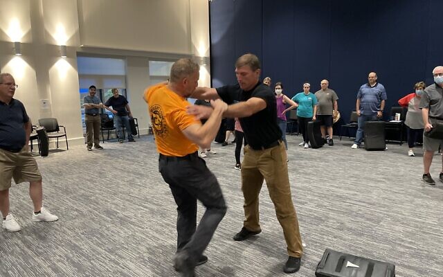 Dave Wright and Mike Saldutte of Wright’s Gym demonstrate a self-defense technique (Photo by Ethan Beck)