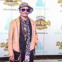 Johnny Depp attends the Grand Opening of the Guitar Hotel expansion at Seminole Hard Rock Hotel & Casino Hollywood, in Hollywood, Florida, October 24, 2019. (Zak Bennett/AFP via Getty Images)