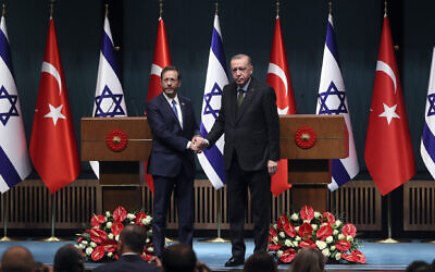 Israeli President Isaac Herzog, left, shakes hands with Turkish President Recep Tayyip Erdogan in Ankara, Turkey, March 9, 2022. (Halil Sagirkaya/Anadolu Agency via Getty Images)