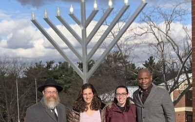 Rabbi Shmuel Weinstein, RMU students, Miriam Levenson, Sarah Jackson and former President Christopher Howard. Photo provided by Chabad on Campus.