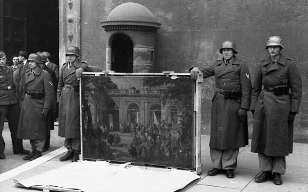 German soldiers in Naples, Italy, in 1944, pose with a painting taken from the National Museum of Naples Picture Gallery,
(Courtesy of Bundesarchiv via Wikimedia Commons)