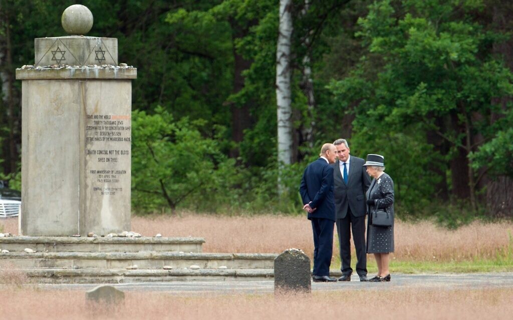 Queen Elizabeth II visits the concentration camp memorial at Bergen-Belsen in Lohheide, Germany, June 26, 2015. With her are Prince Philip and Jens-Christian Wagner, director of the memorial. (Julian Stratenschulte/Pool/Getty Images)