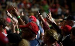 Audience members raise their right hands while former President Donald Trump speaks at a rally at the Covelli Centre in Youngstown, Ohio, Sept. 17, 2022. (Jeff Swensen/Getty Images)