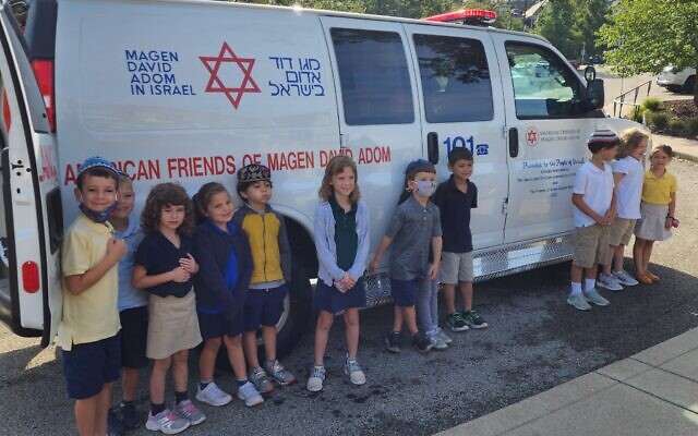 An ambulance that will eventually make its way to Israel was dedicated at Community Day School. Photo by Adam Reinherz