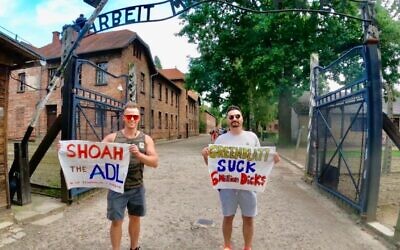 Polish authorities arrested Jon Minadeo Jr., right, after he published a photo taken at Auschwitz. The photo sparked outrage on social media.