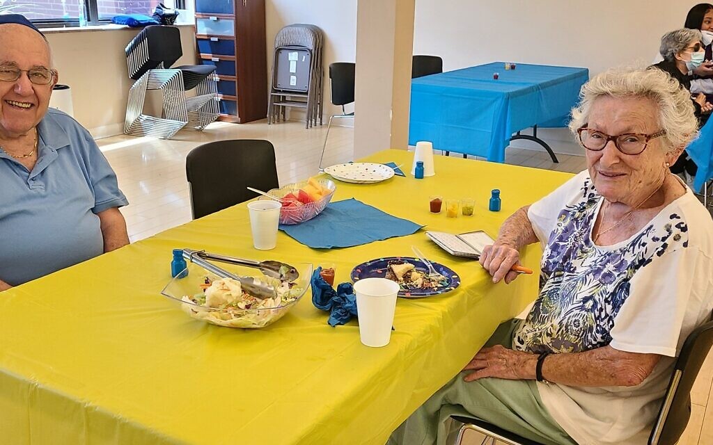 Reuben Abromowitz and Hilda McNabb enjoy their time together at a summer seniors luncheon at Chabad of  the South Hills. (Photo courtesy of Batya Rosenblum)