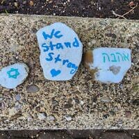Painted rocks left outside the Tree of Life building. (Photo by Adam Reinherz)
