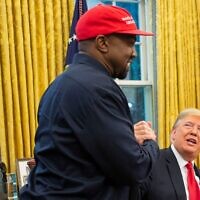 President Donald Trump and rapper Kanye West embrace in the Oval Office of the White House, Oct. 11, 2018. (Calla Kessler/The Washington Post via Getty Images)