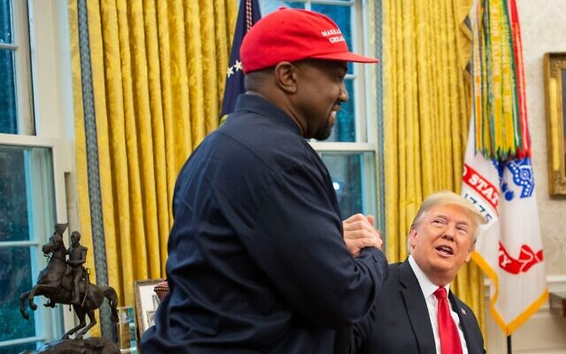 President Donald Trump and rapper Kanye West embrace in the Oval Office of the White House, Oct. 11, 2018. (Calla Kessler/The Washington Post via Getty Images)