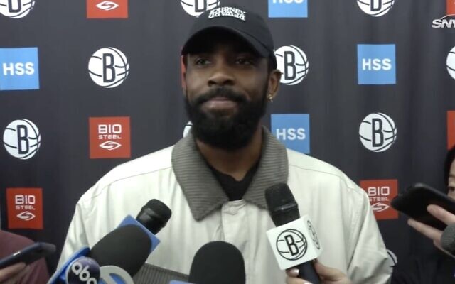 Kyrie Irving speaks to reporters, Nov. 3, 2022. He has sparked outrage among some Jewish groups for promoting an antisemitic movie. (Screenshot)