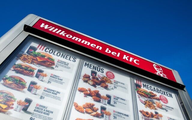 "Welcome to KFC" is written above a drive-in menu at the fast food chain Kentucky Fried Chicken (KFC) in Duesseldorf, Nov. 18, 2020. (Rolf Vennenbernd/picture alliance via Getty Images)