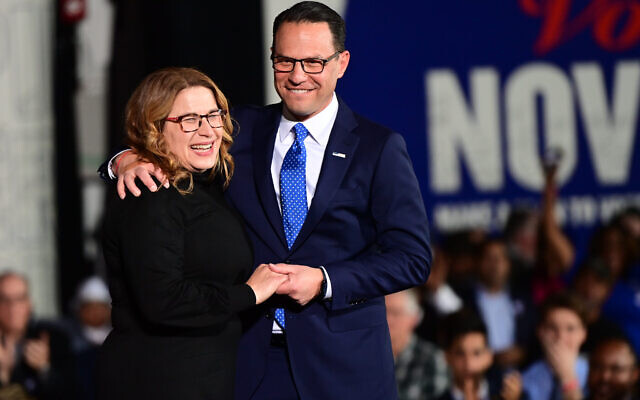 OAKS, PA - NOV. 08: Democratic gubernatorial nominee Josh Shapiro embraces his wife, Lori Shapiro, on stage after giving a victory speech to supporters at the Greater Philadelphia Expo Center on Nov. 8, 2022, in Oaks, Pennsylvania. Shapiro defeated Republican gubernatorial candidate Doug Mastriano. (Photo by Mark Makela/Getty Images)