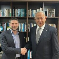 Likud party leader Benjamin Netanyahu, left, and Religious Zionism party leader Bezalel Smotrich sign a coalition deal in Jerusalem on Dec. 1, 2022. (Likud)