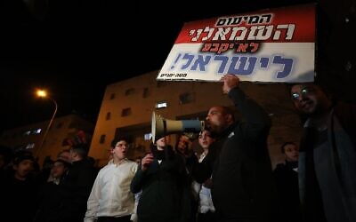 Shas Party members gather outside the house of Israeli Interior and Health Minister Aryeh Deri, who heads the Shas Party, after Israel's Supreme Court's verdict in Jerusalem, Jan. 18, 2023. (Mostafa Alkharouf/Anadolu Agency via Getty Images)