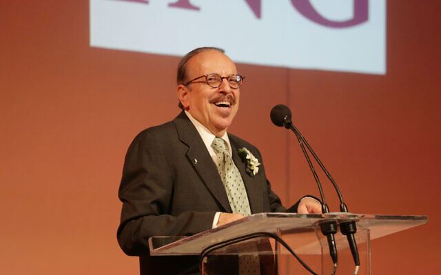 Jud Newborn accepting the Anne Frank “Human Writes” Spirit Award. Photo courtesy of the Anne Frank Center.
