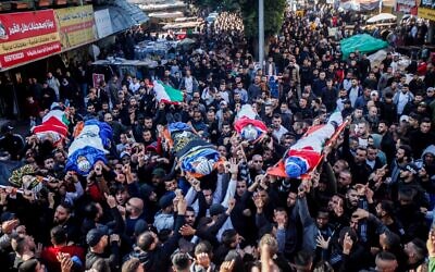 Mourners carry the bodies of Palestinians who were shot dead by Israeli security forces during a Military operation, in the West Bank city of Jenin, Jan. 26, 2023. (Nasser Ishtayeh/Flash90)