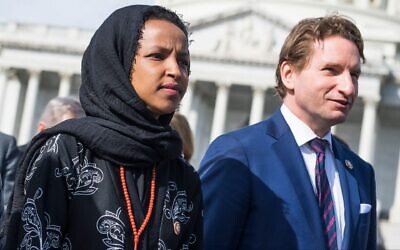 Reps. Ilhan Omar and Dean Phillips make their way to the Supreme Court for a rally with congressional Democrats, April 2, 2019. (Tom Williams/CQ Roll Call)