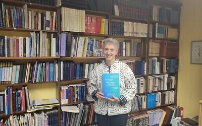 Rabbi Barbara Symons holds the new book, “Prophetic Voices: Renewing and Reimaging Haftarah."