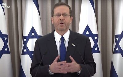 President Isaac Herzog delivers a message to the nation from his office in Jerusalem, Feb. 12, 2023. (Screenshot/ GPO via The Times of Israel)
