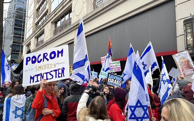 Jewish Americans and Israeli ex-pats protest against Finance Minister Bezalel Smotrich outside the Grand Hyatt hotel in Washington on March 12, 2023. (Photo by Jacob Magid/Times of Israel)