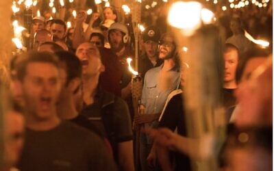 Neo-Nazis and white Supremacists take part in a march the night before the Unite the Right rally in Charlottesville, Va., Aug. 11, 2017. (Zach D Roberts/NurPhoto via Getty Images)