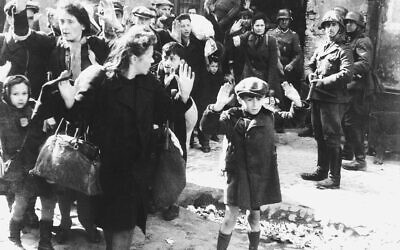 An iconic photo from the Warsaw Ghetto shows Jews being led by Nazis in 1943. (U.S. Holocaust Museum/Wikimedia Commons)