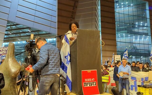 Shula Mola speaks during a demonstration in Israel. Photo by Tanya Zion-Waldoks