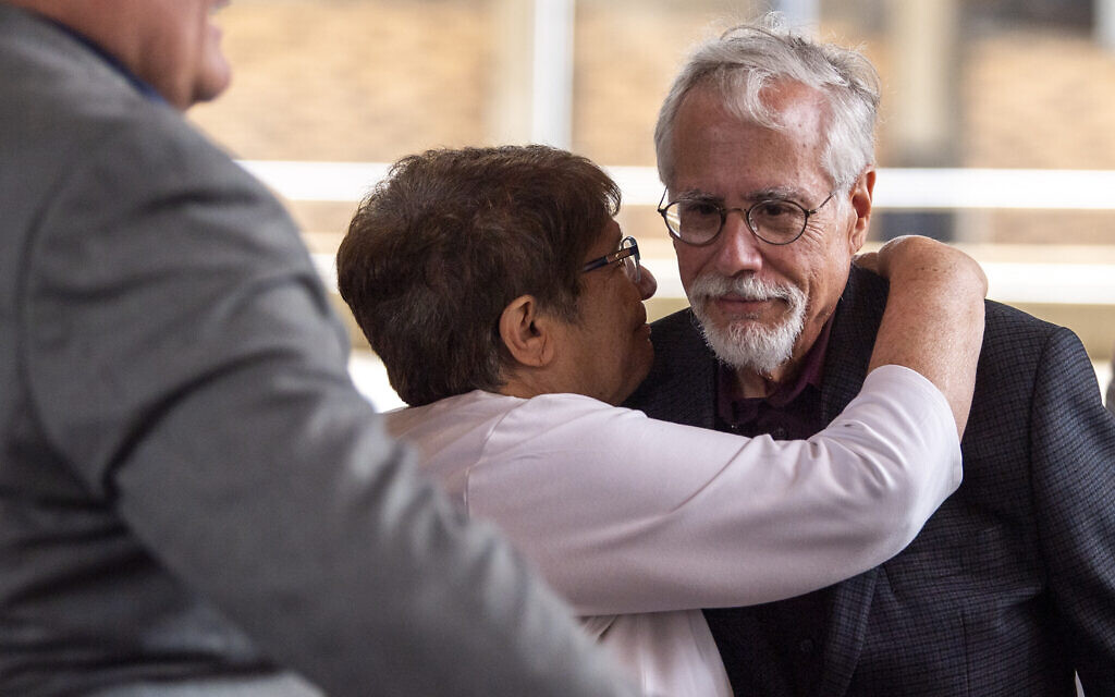 New Light Congregation co-presidents Barbara Caplan and Stephen Cohen hug at the start of a press conference after the jury found the Pittsburgh synagogue shooter guilty of federal hate crimes, Friday, June 16, 2023, Downtown. (Alexandra Wimley/Union Progress)